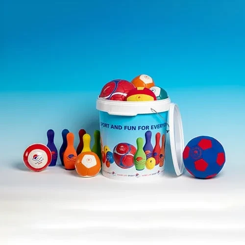 A care-home activity kit: a tub of soft balls with bowling skittles and a blue-and-red foam football.