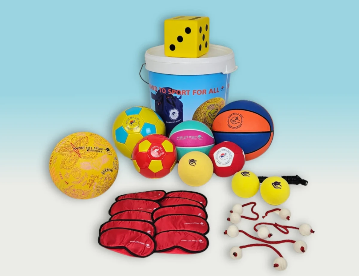 A play set: a tub, audible balls of many colours, a yellow foam dice, red masks and walking globes.