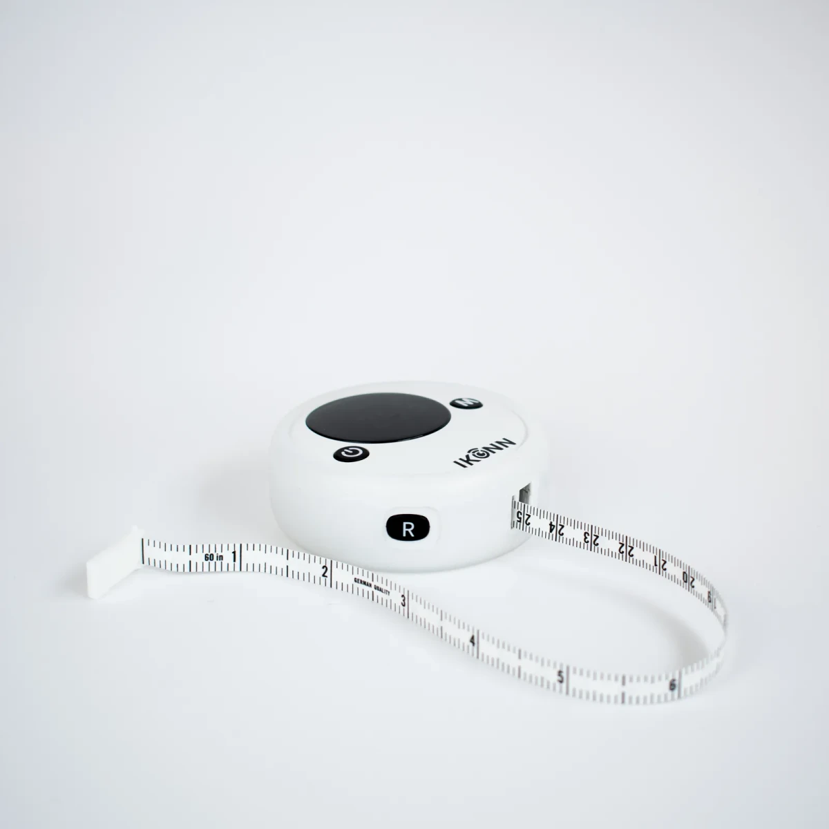 Back of the MT-1 showing the R retract button and the inch face of the tape