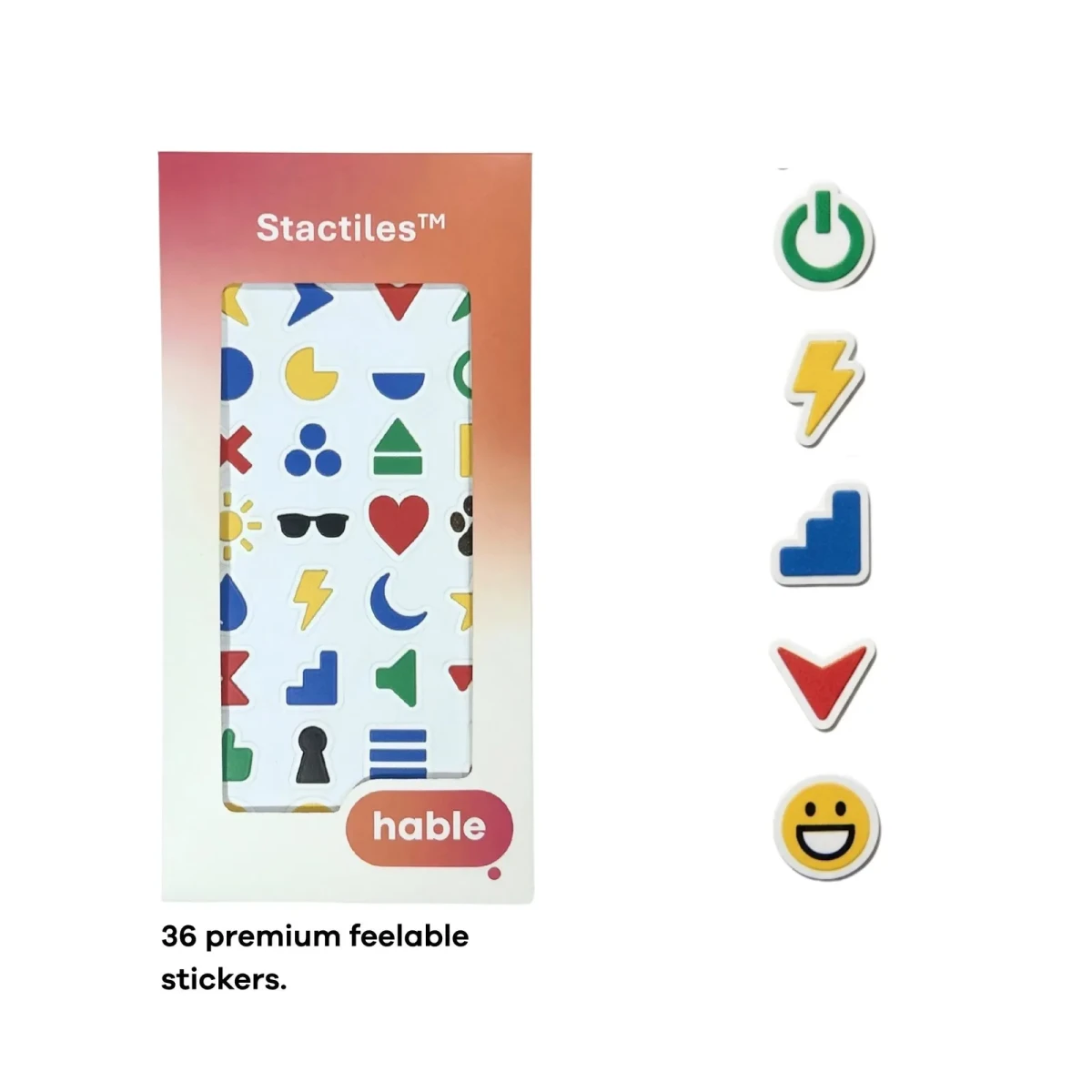 Il foglio di adesivi Hable Stactiles Icons mostrato nella sua scatola arancione, accanto a una fila verticale di cinque adesivi ingranditi: un simbolo di accensione verde, un fulmine giallo, una forma a scala blu, una freccia rossa verso il basso e una faccina sorridente gialla. Il testo recita 36 adesivi tattili premium.