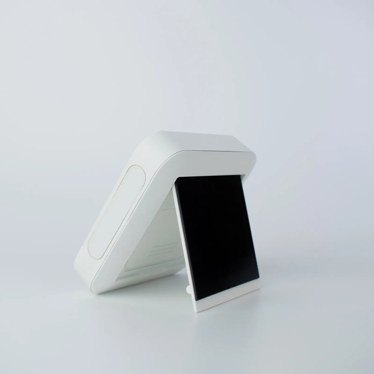 Back of the TK-1 showing the black magnet panel and the fold-out stand propped open