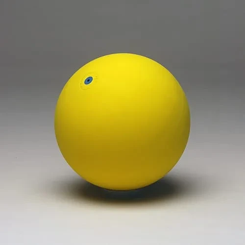 The yellow version: a bright matt yellow ball with a small blue valve disc.
